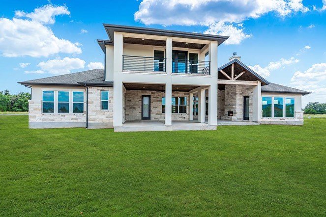 Two-story limestone custom home south of Lake Georgetown, Williamson County TX — built by Chance Leigh Custom Homes