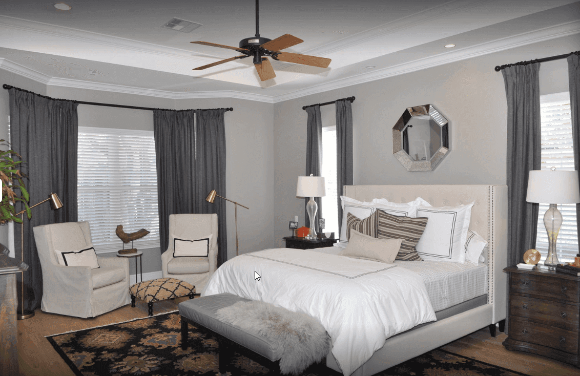Primary bedroom suite with custom trim and natural light